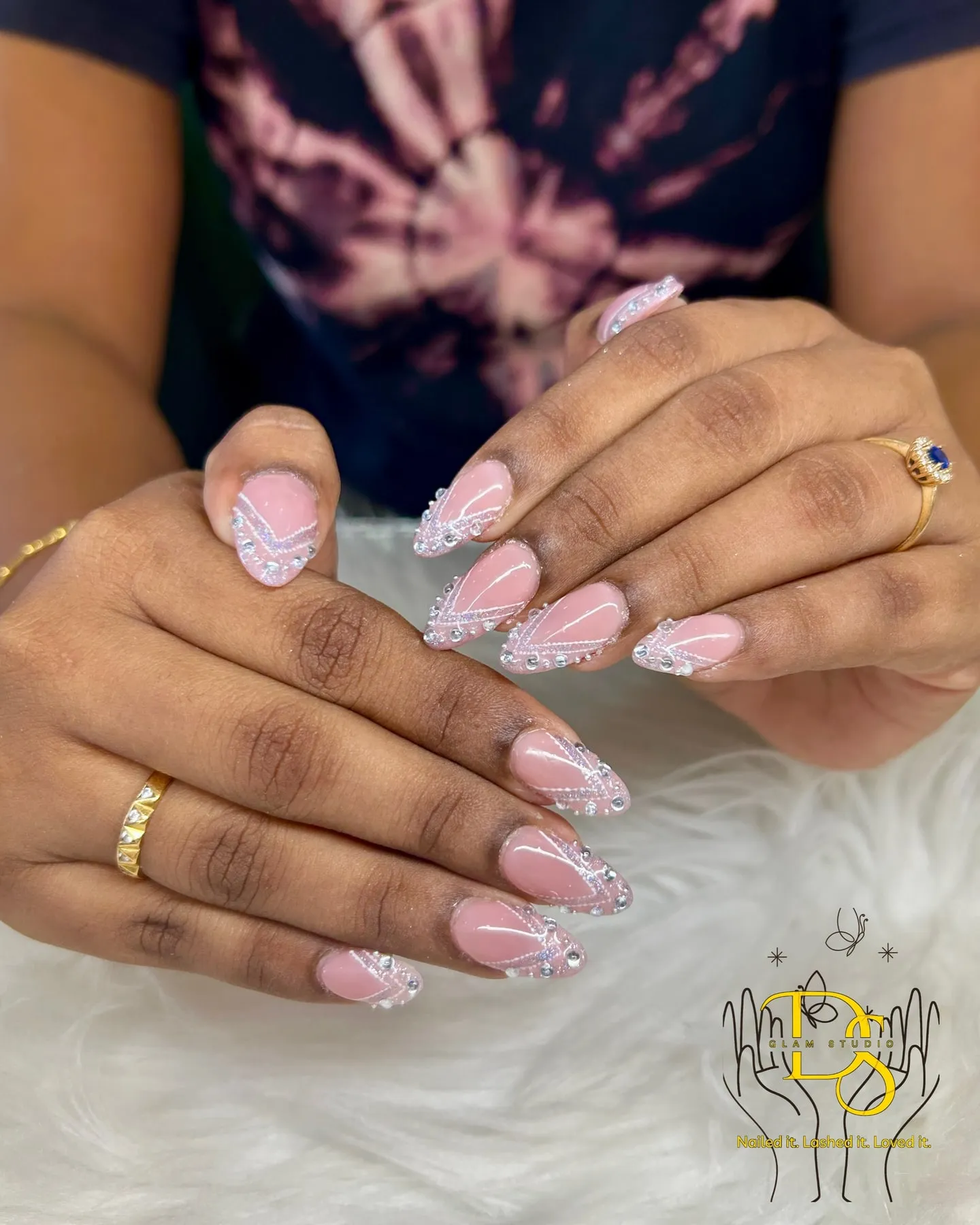 Pale pink almond nails with a sparkle accent