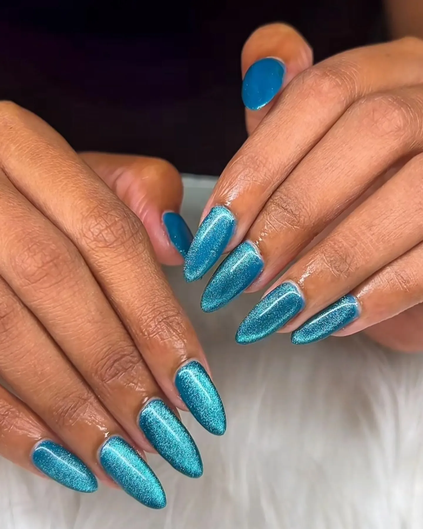 Teal glitter almond nails
